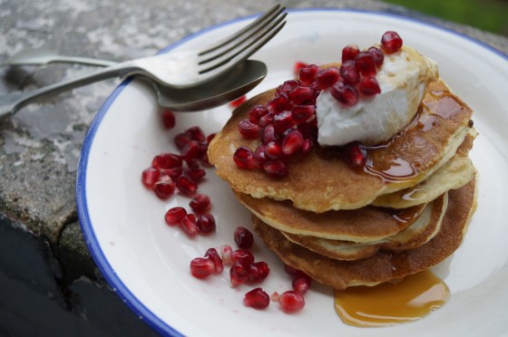 whey pancakes with syrup, cheese and pomegranate